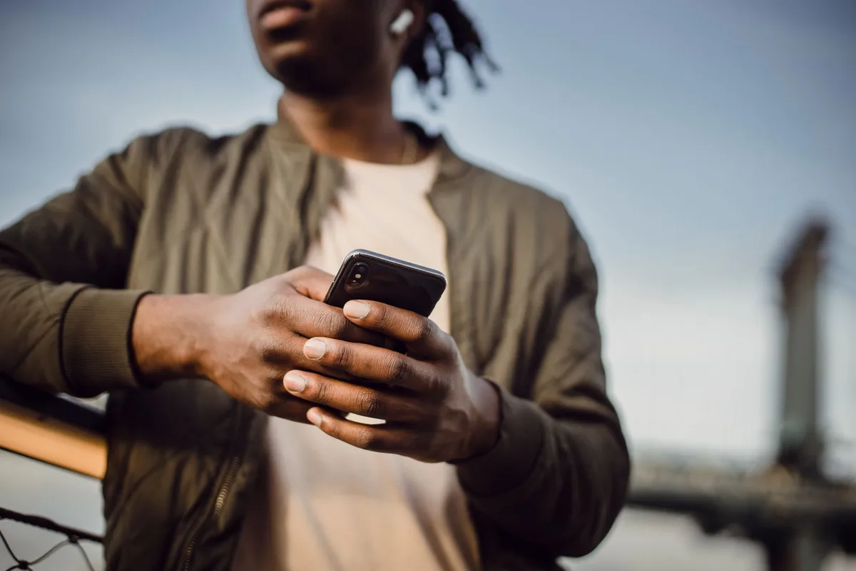 A tenant paying rent from her phone